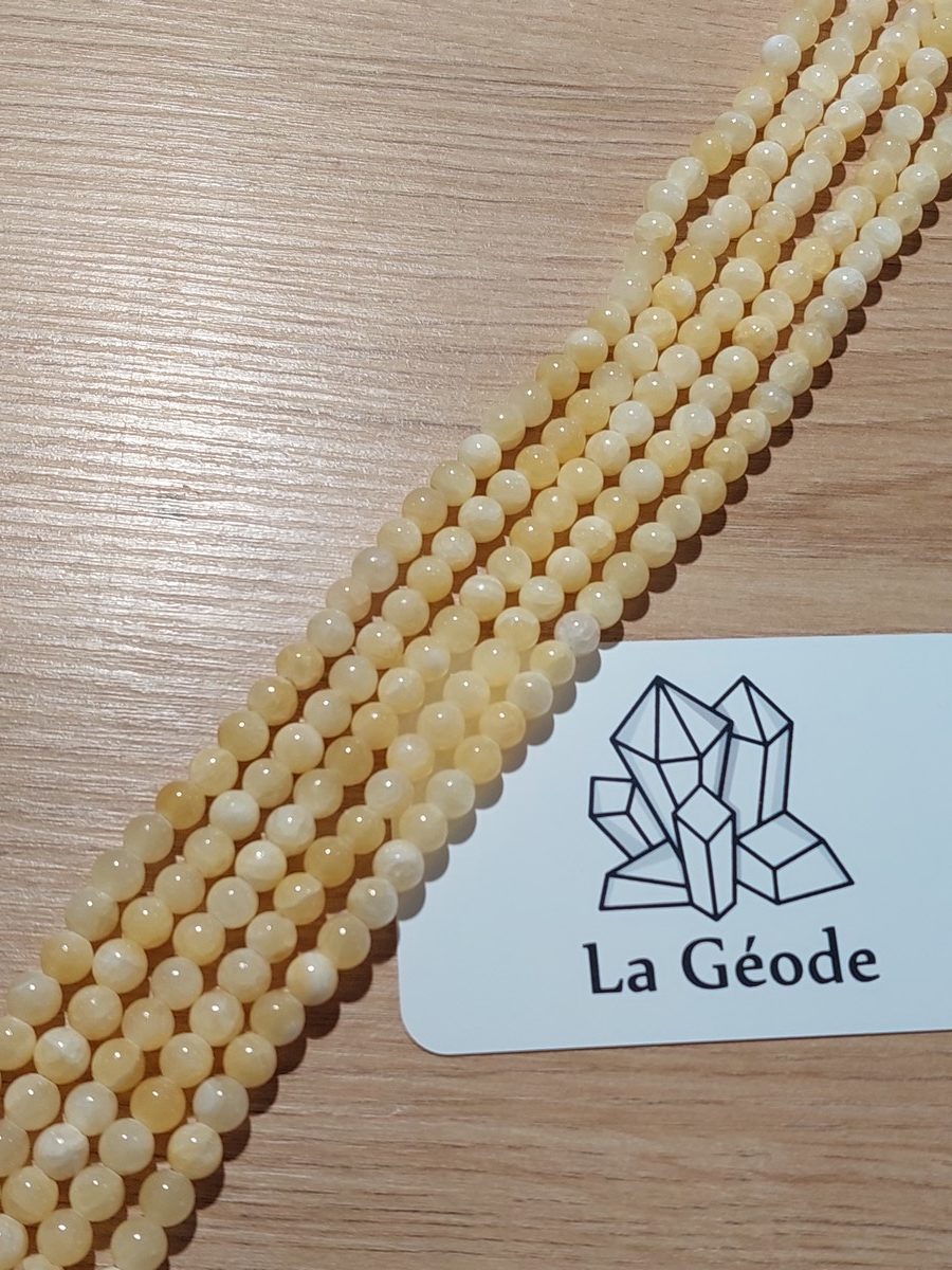 Fil de perles rondes en Calcite orange 6 mm | Boutique suisse de pierres du monde & lithothérapie