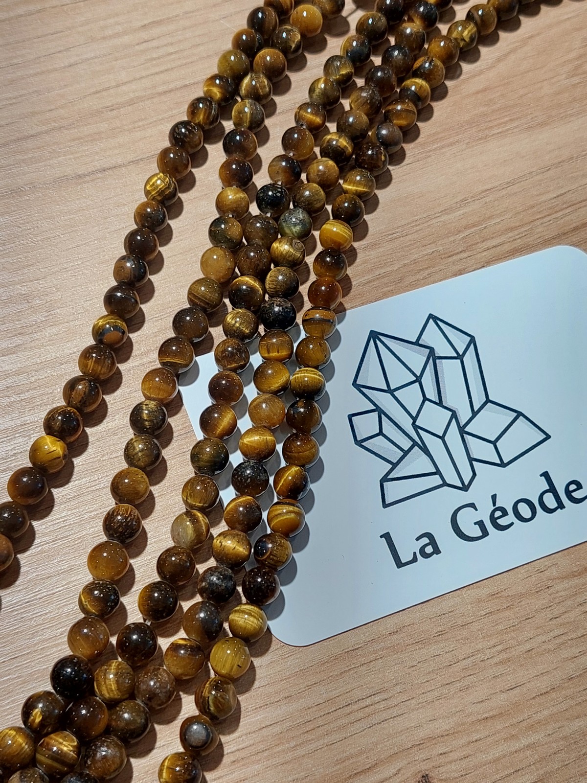 Fil de perles rondes en Oeil de Tigre 6 mm | Boutique suisse de pierres du monde & lithothérapie