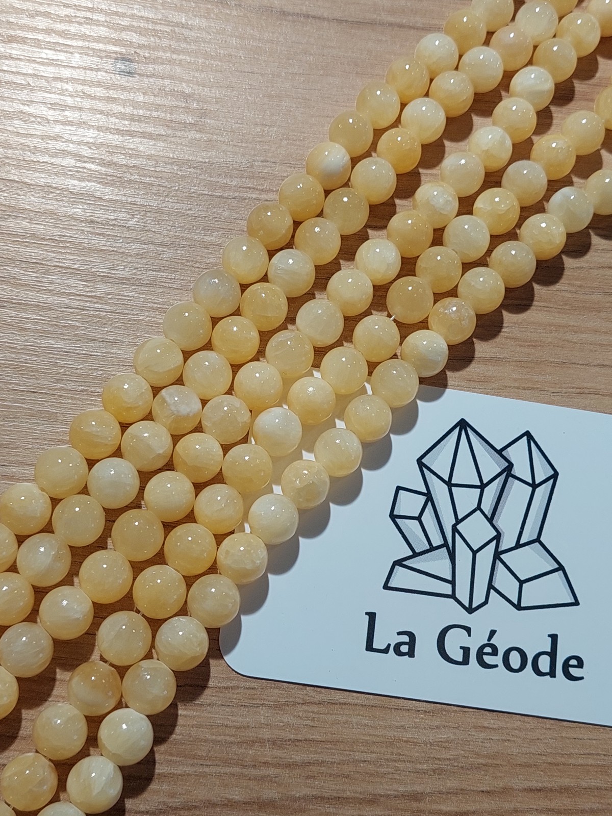 Fil de perles rondes en Calcite orange 8 mm | Boutique suisse de pierres du monde & lithothérapie